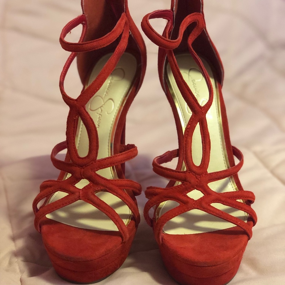 Jessica Simpson strapping red heels